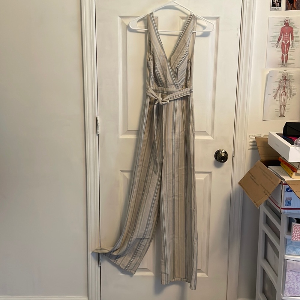 Tan and striped jumpsuit with V-neck back and front